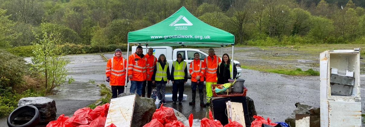 Volunteers at Ground Work Wales get litter picking at the River Rhymney in Wales